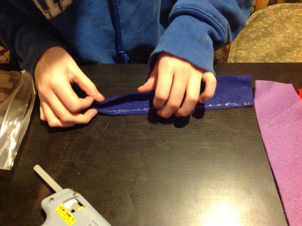 Hot glue the edges together.