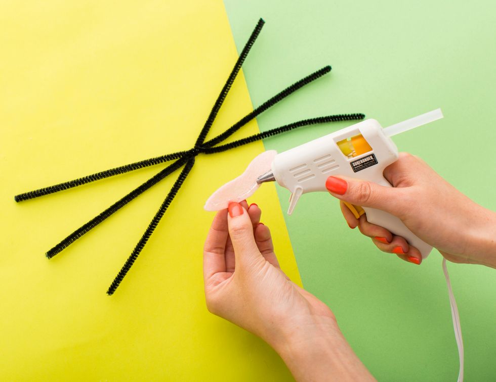 Hot glue the nose over the twist.