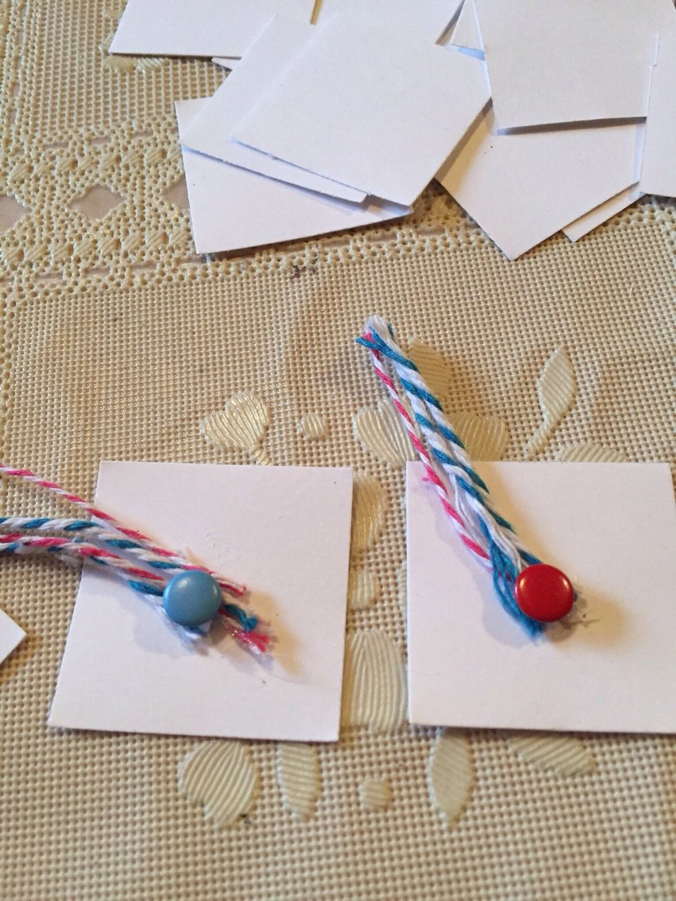 Hot glue twine down to middle of square and add tiny button or embellishment on the middle of cap.