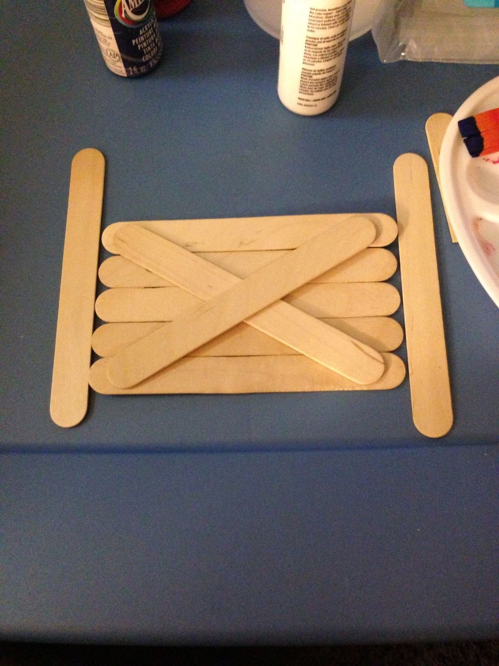 Hot glue two sticks for backing. I did in a criss cross but you can snap a popsicle stick in half or something else :)