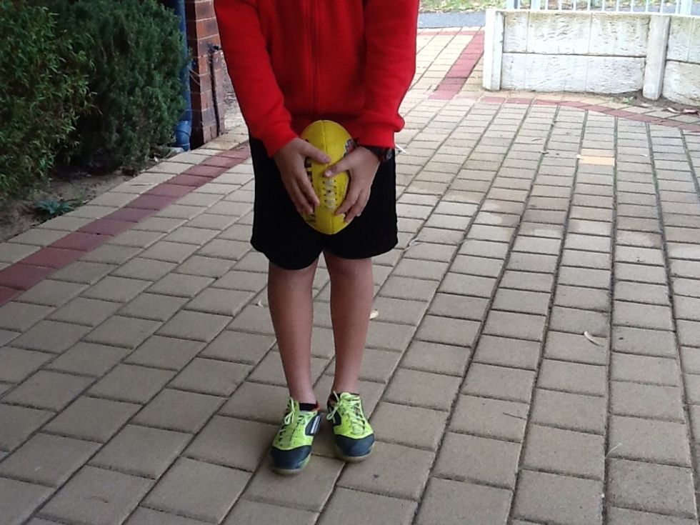 How to hold a football.