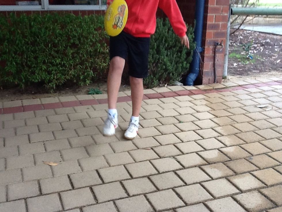 How to hold the football while taking steps to shoot.