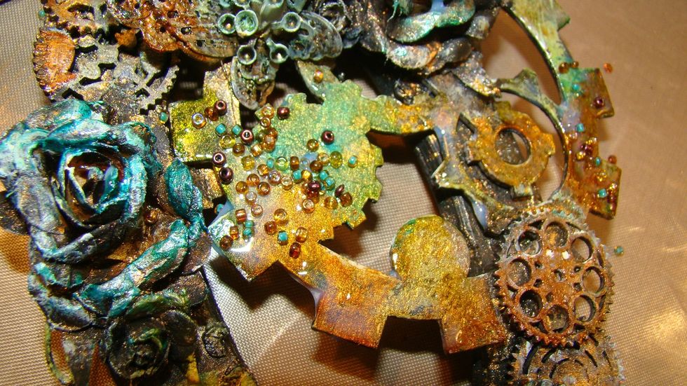 Hummm... more texture needed so I decided to apply Crackle varnish here and there and I sprinkled on seed beads. Allow to dry.