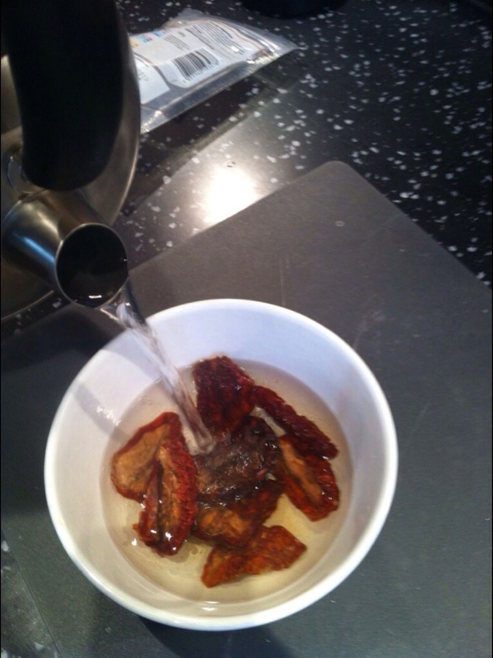 Hydrate tomatoes in a bowl with boiling water for 10 minutes.