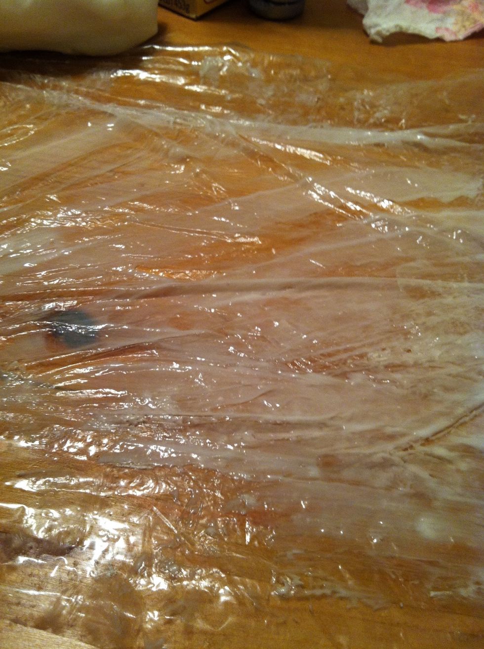 I accidentally deleted the picture with the first lotion step. Basically lay down your plastic wrap and dot it with lotion, spread it around in a thin layer. This helps it not stick.