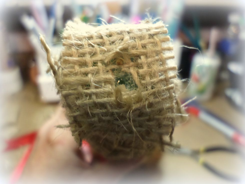I Add a small piece of burlap to the top of the tree, using Tombow Xtreme Adhesive. Then I cut a small hole in the top.
