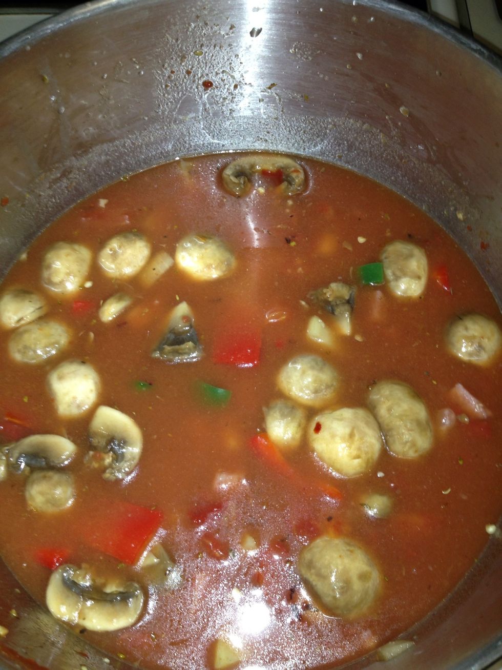 I add all cans of beans and tomato sauces and beef stock bring to a simmer