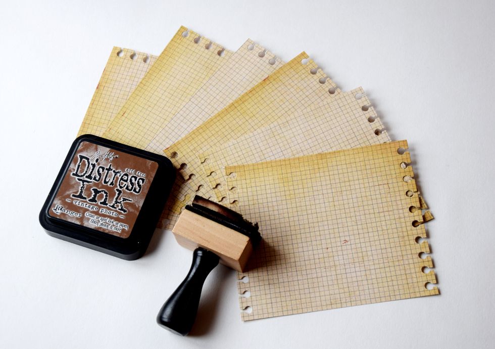 I add some vintage look to the paper with distress ink.