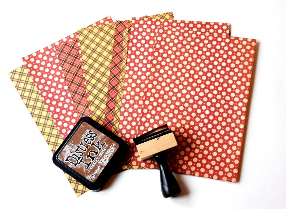 I add some vintage look to the paper with distress ink.