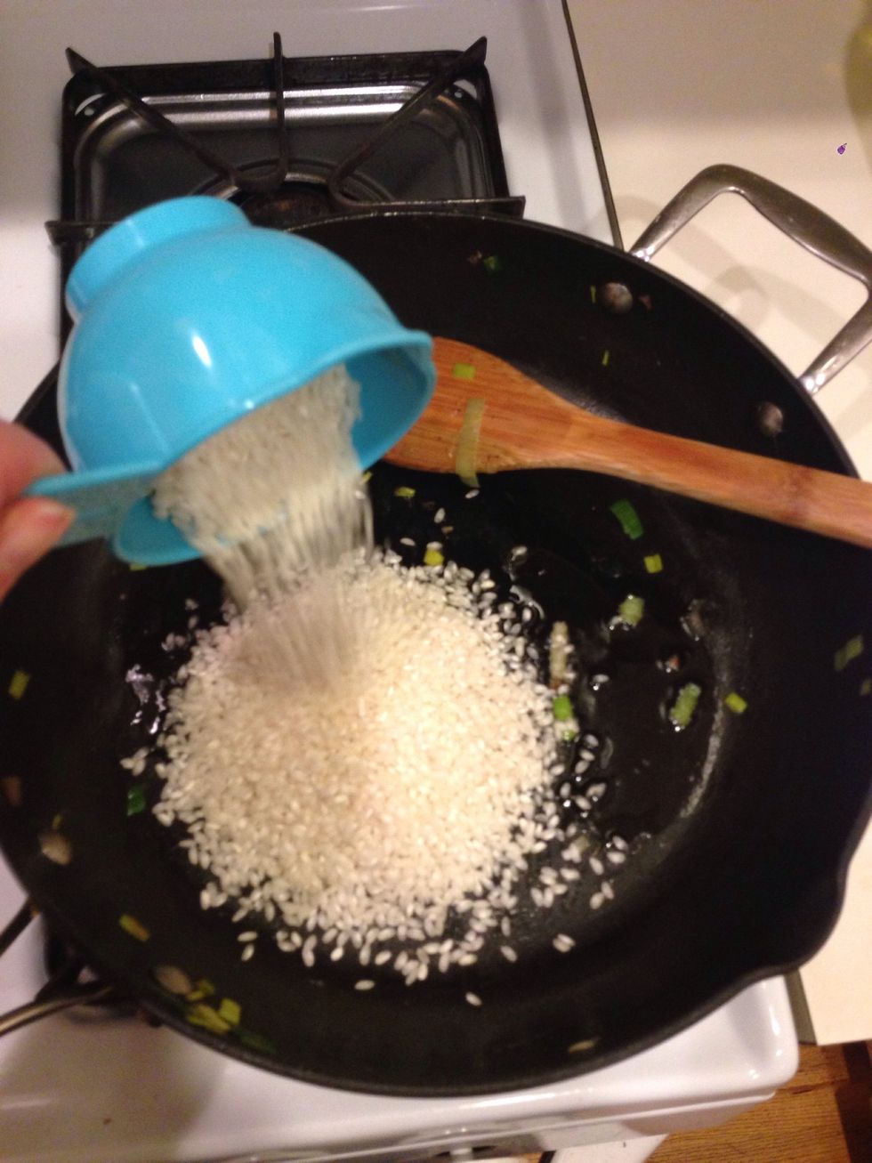 I added 2 tbsp of olive oil, and then added 1 cup of arborio rice.