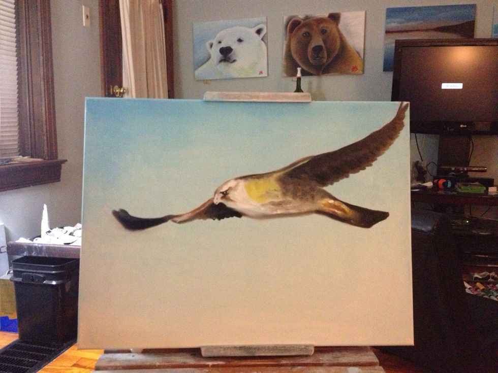 I added a little golden yellow to the body and started working the face with a liner brush