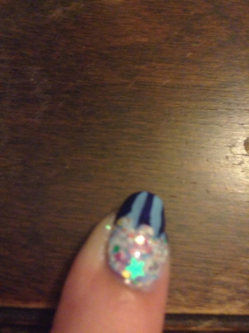 I added a little star. From a little nail stud wheel, from Claire's. Completely optional. Also, you can outline the top part of your cupcake, I didn't b/c I was lazy.