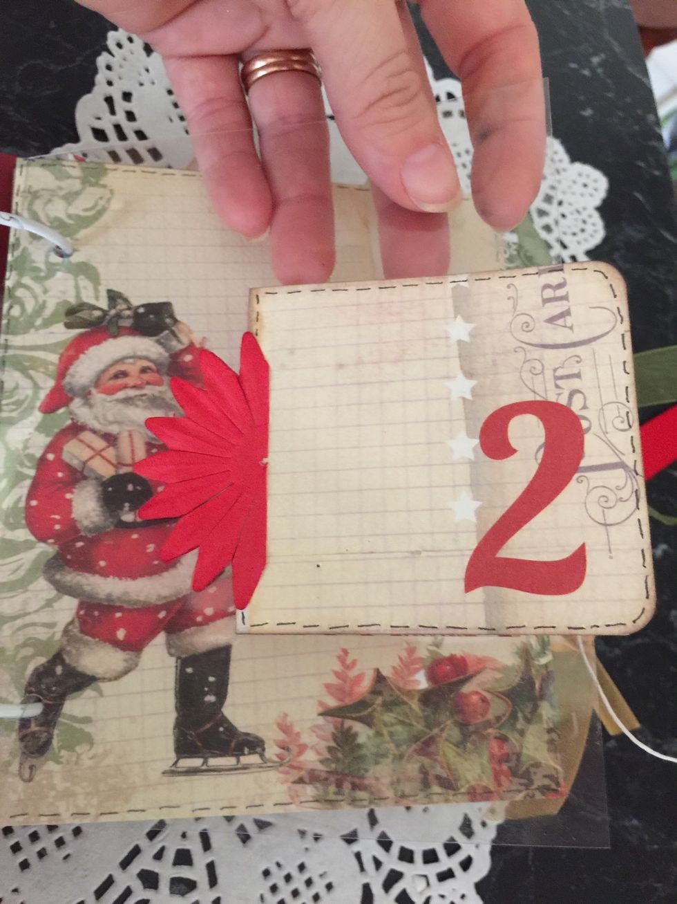 I added a page or two of acetate packaging as well, just for interest. Just make sure what you adhere to the opposite side goes over the same space so you can hide the adhesive.