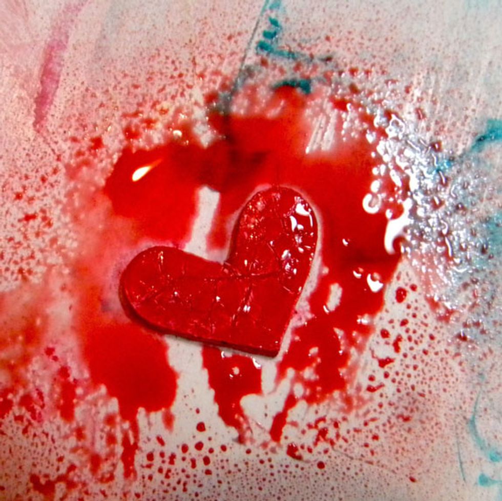 I added a red chipboard heart to the angel, first treating it with gesso, Heart Colorations spray, crackle paste and left over brown glaze. I glued it to the angel with gel medium.