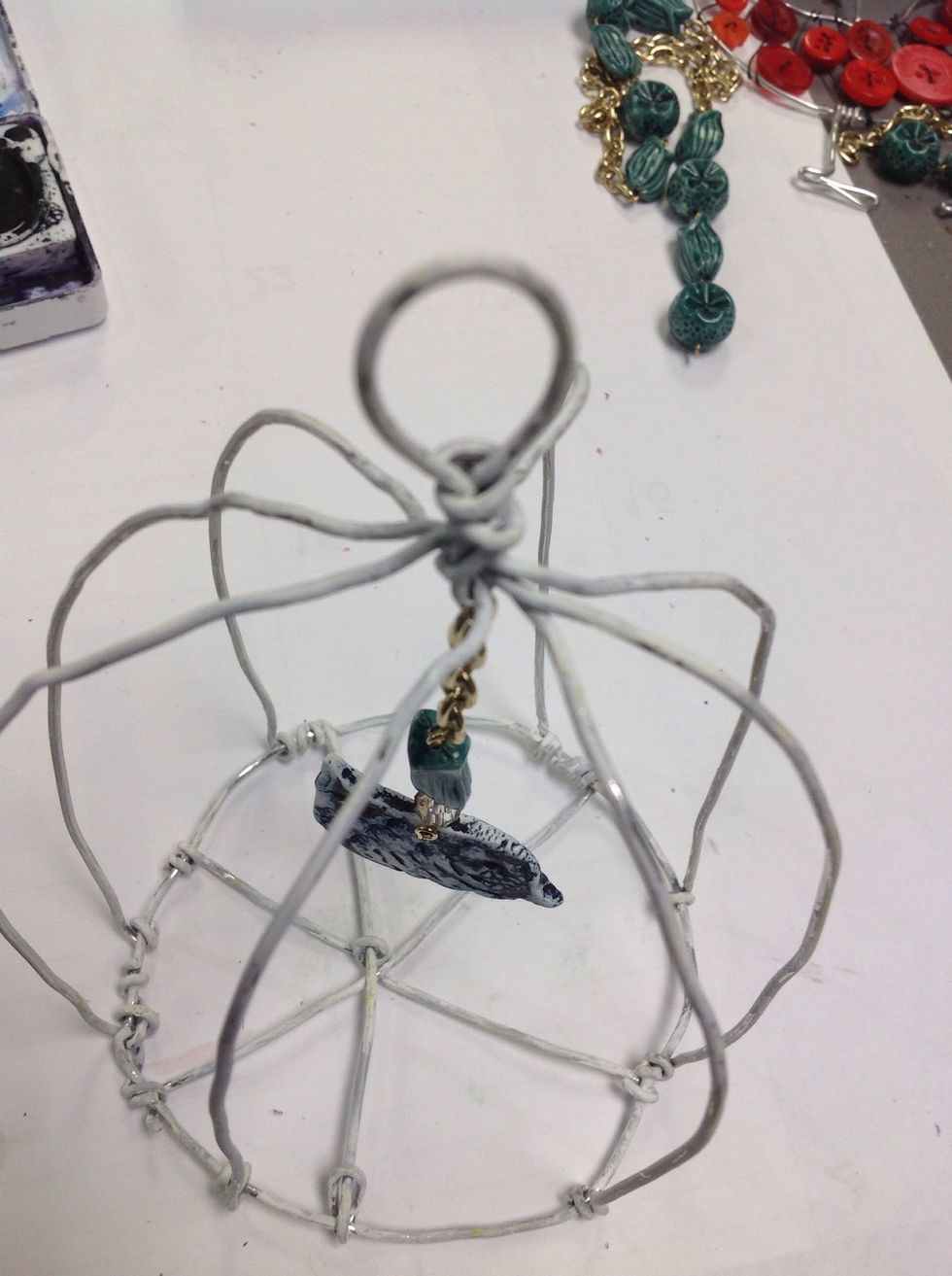 I added about an inch of a broken necklace chain to add length to my bird.