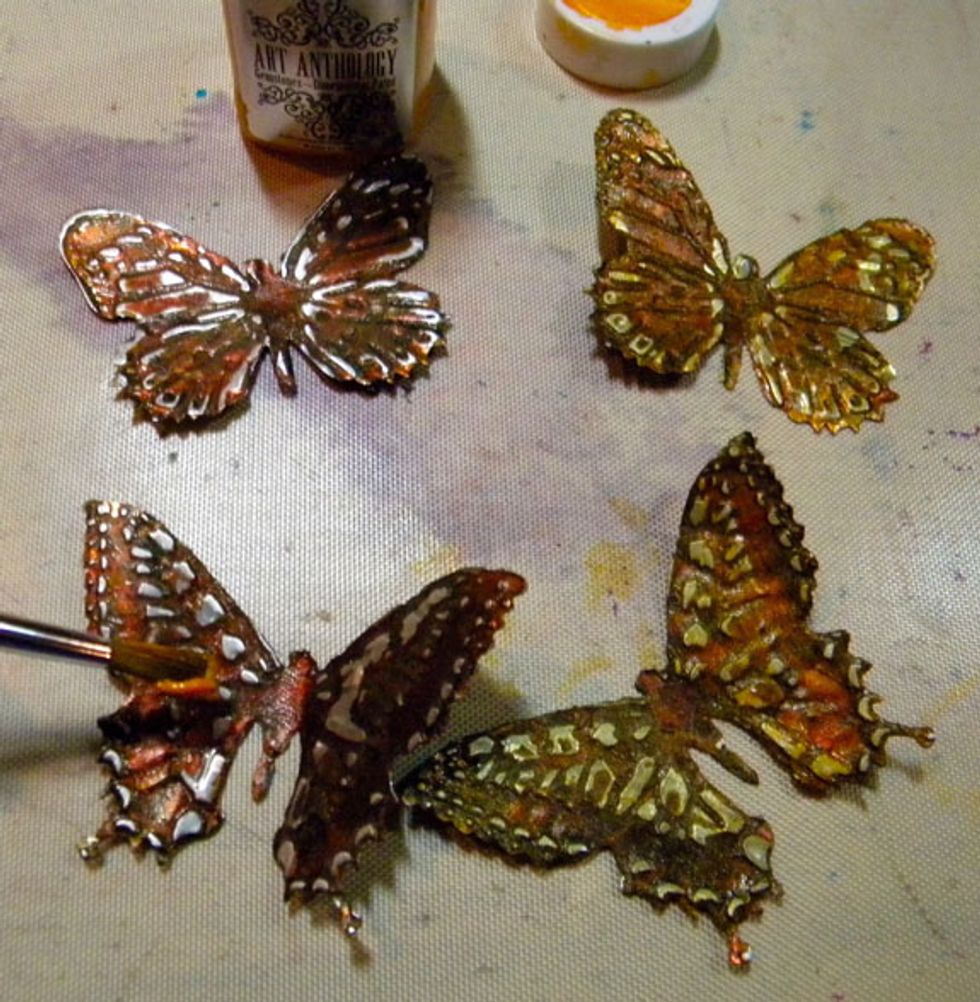 I added another layer of Amber Gemstones to the butterflies after I sanded them. I then painted the center "body" with Black Velvet.