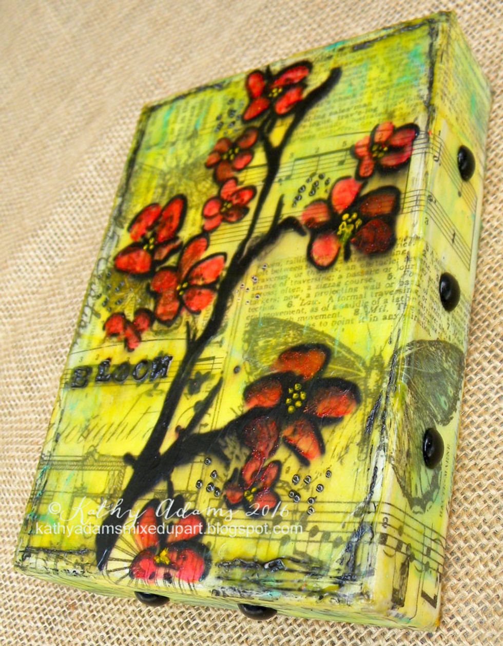 I added black upholstery tacks to the sides of the canvas.