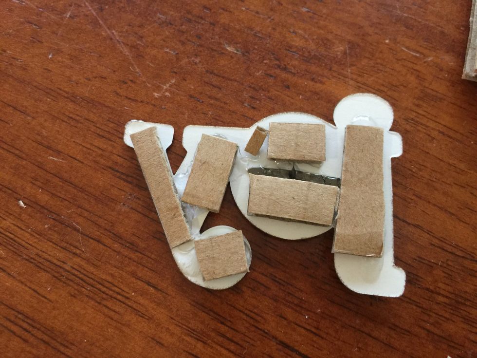 I added cardboard to the back of a diecut sticker to add dimension to the title.