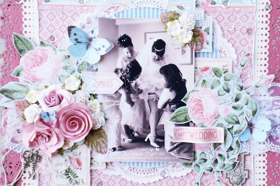 I added cheesecloth under the cluster of flowers to add dimension and interest. The postage stamps from the Graphic 45 papers are always a fun element to accent with.