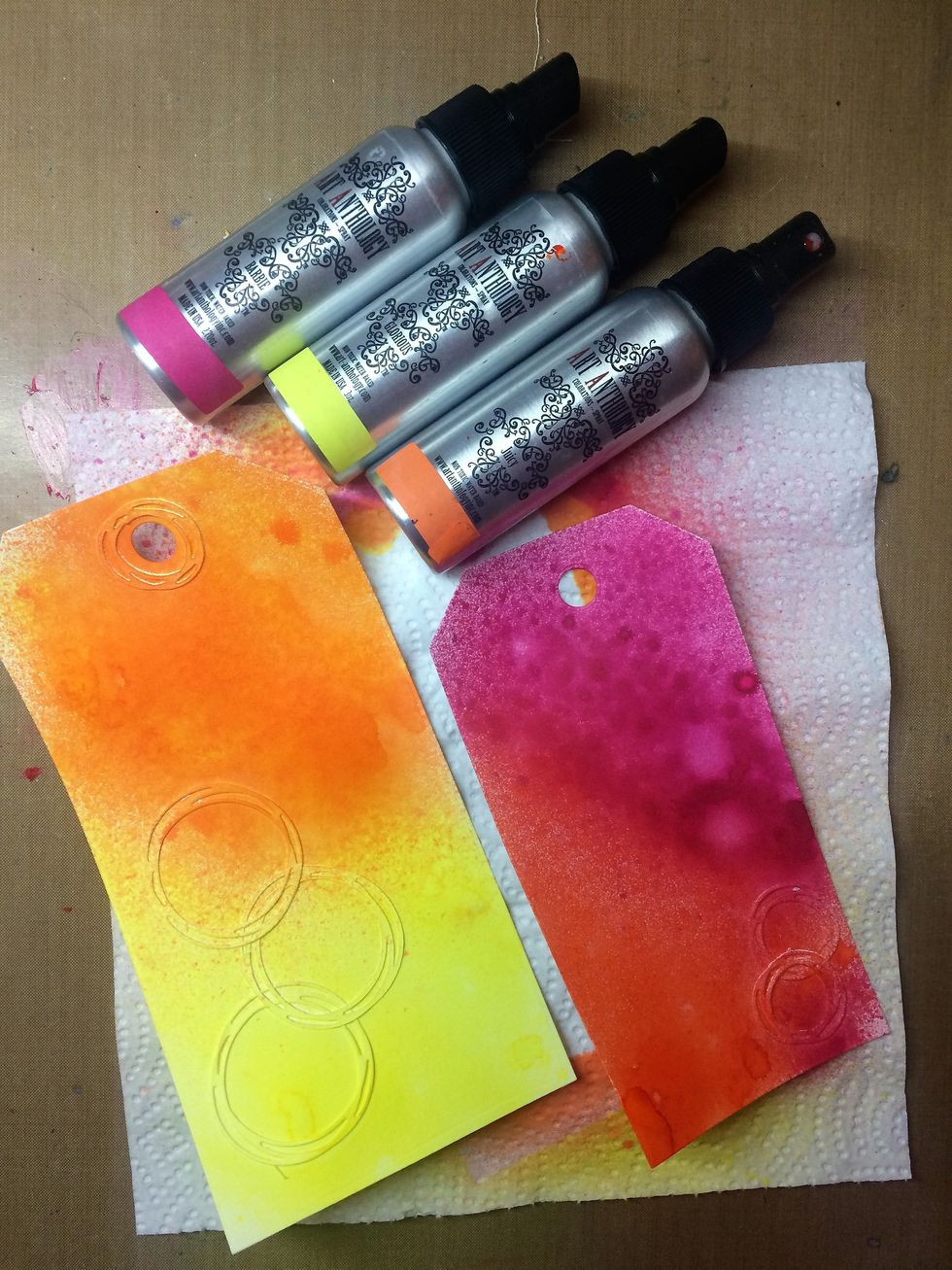 I added die cuts to two tags and sprayed them with colorations.