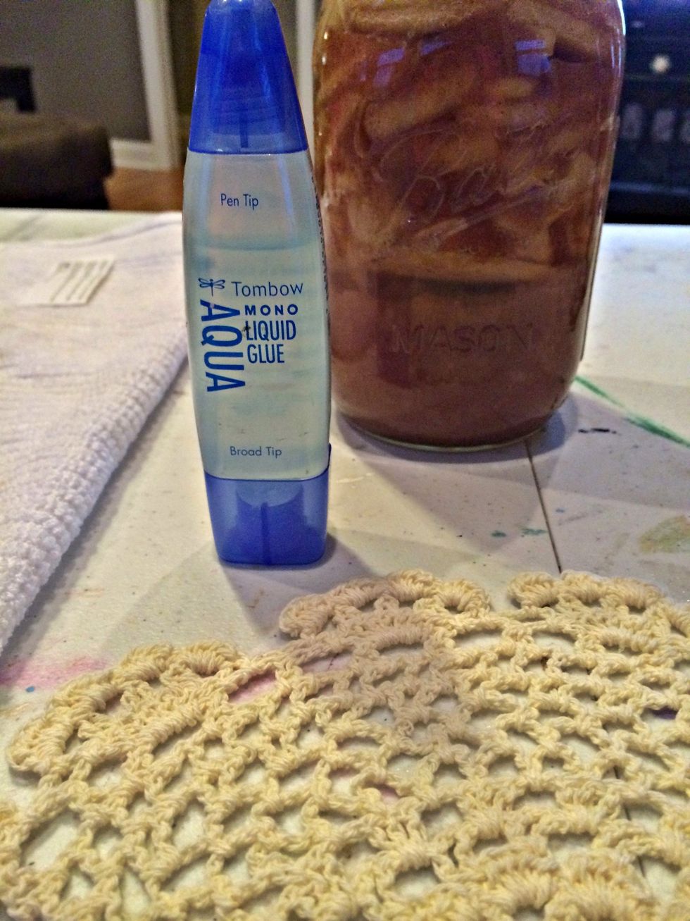 I added dots of Tombow glue to one side of the doily. NOTE: please let the glue set for a couple of minutes, this will help it adhere to the glass.
