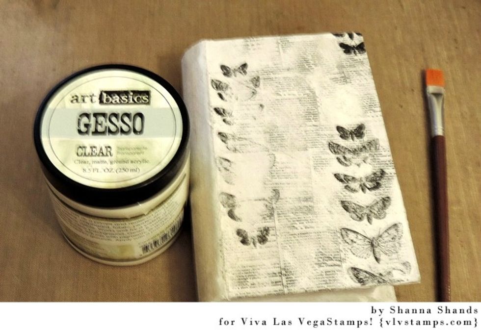 I added more stamping then coated this with clear gesso so the surface was ready to add color. (Sorry for the blurred shot.)