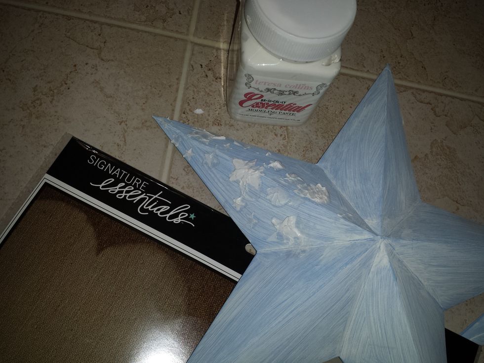 I added some modeling paste using the Teresa Collins "stencil" featuring stars for more texture.