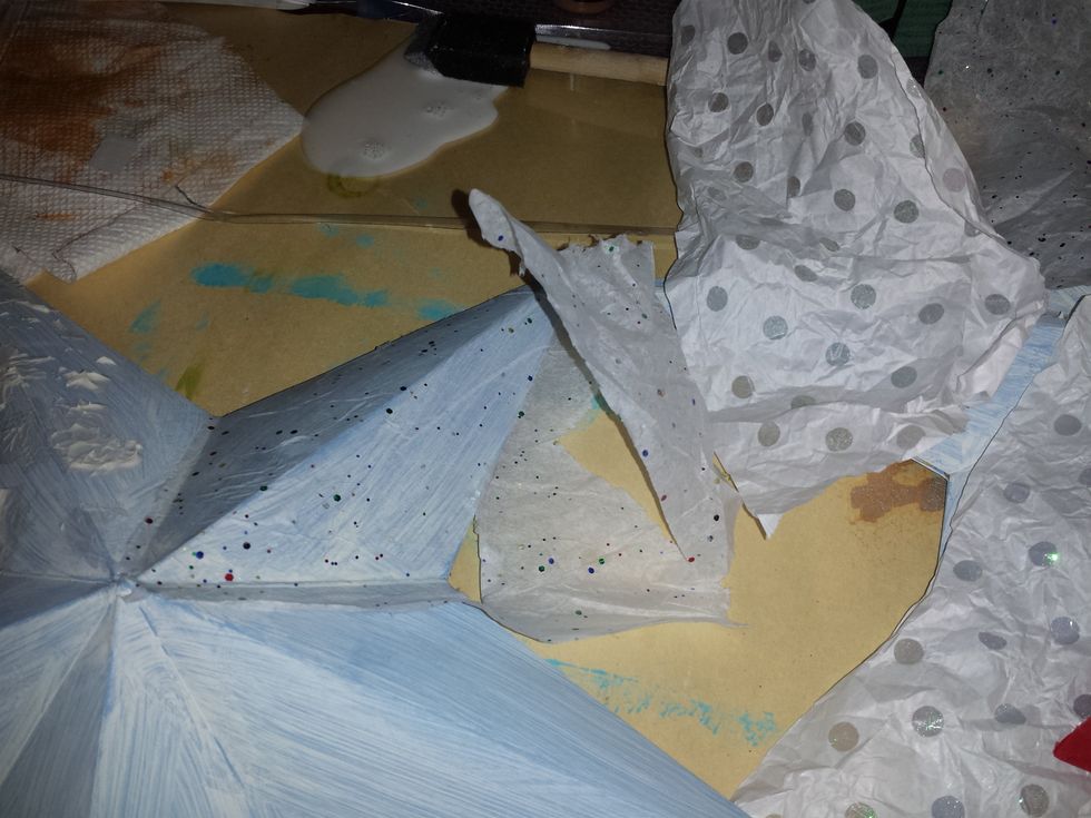 I added some modpodge and 3 different tissue papers to get more dimension in each pick of the star.