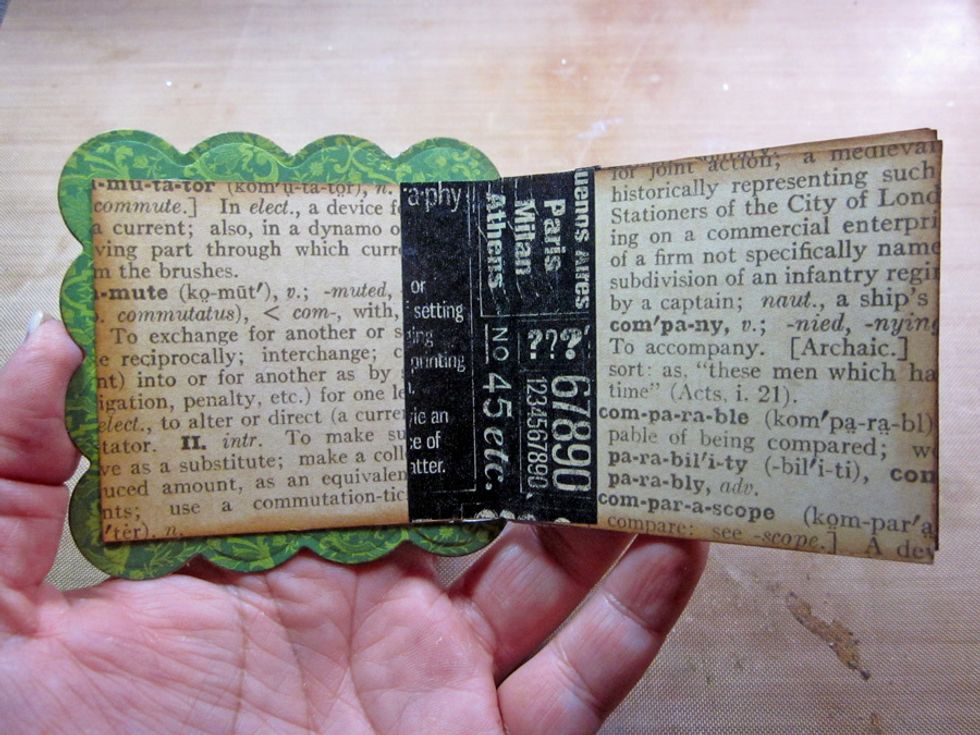 I added some of Washi Graphic 45 to the inside fold of each page for interest. Now the fun part decorating the mini book.