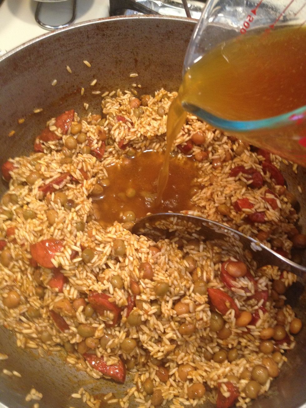 I added some water as well to the broth to bring it to 2 1/8 cups. You can use plain water if you don't have pork broth. I happen to have it since I made pernil to accompany this rice.