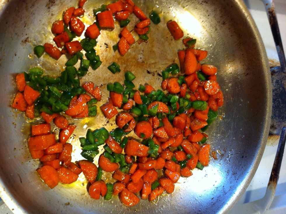 I added the onions to the crockpot then added oil to my pan and put in the carrots with a bit of salt. I cooked them till just browning and shriveling then added some jalape\u00f1os.