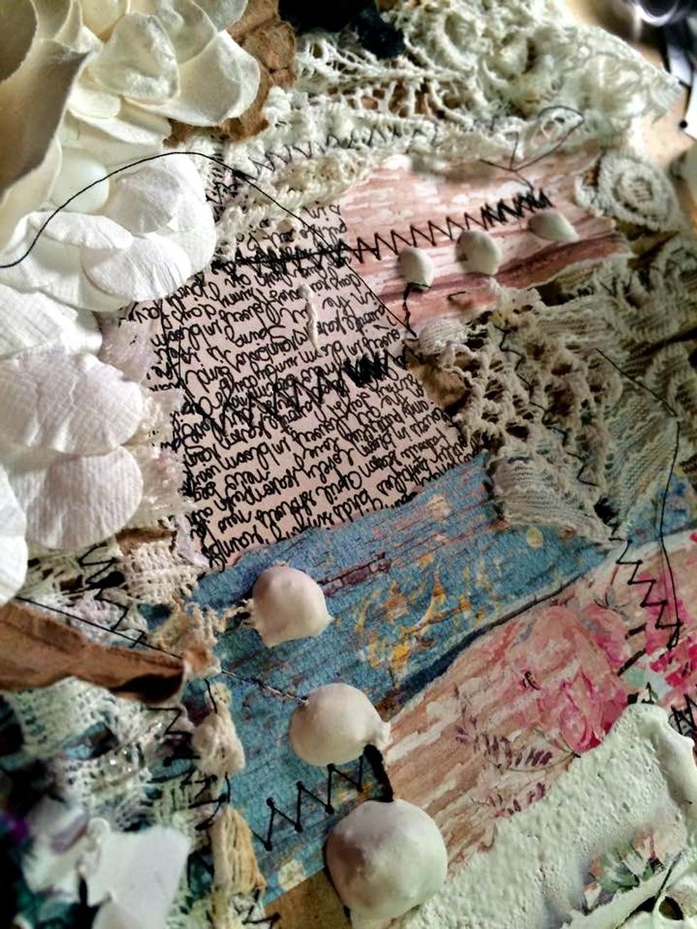 I added the stucco along the edges, and on some of the lace and overlapped it onto the paper as well. I got a good amount on the end of the palette knife and let it fall off forming little balls.