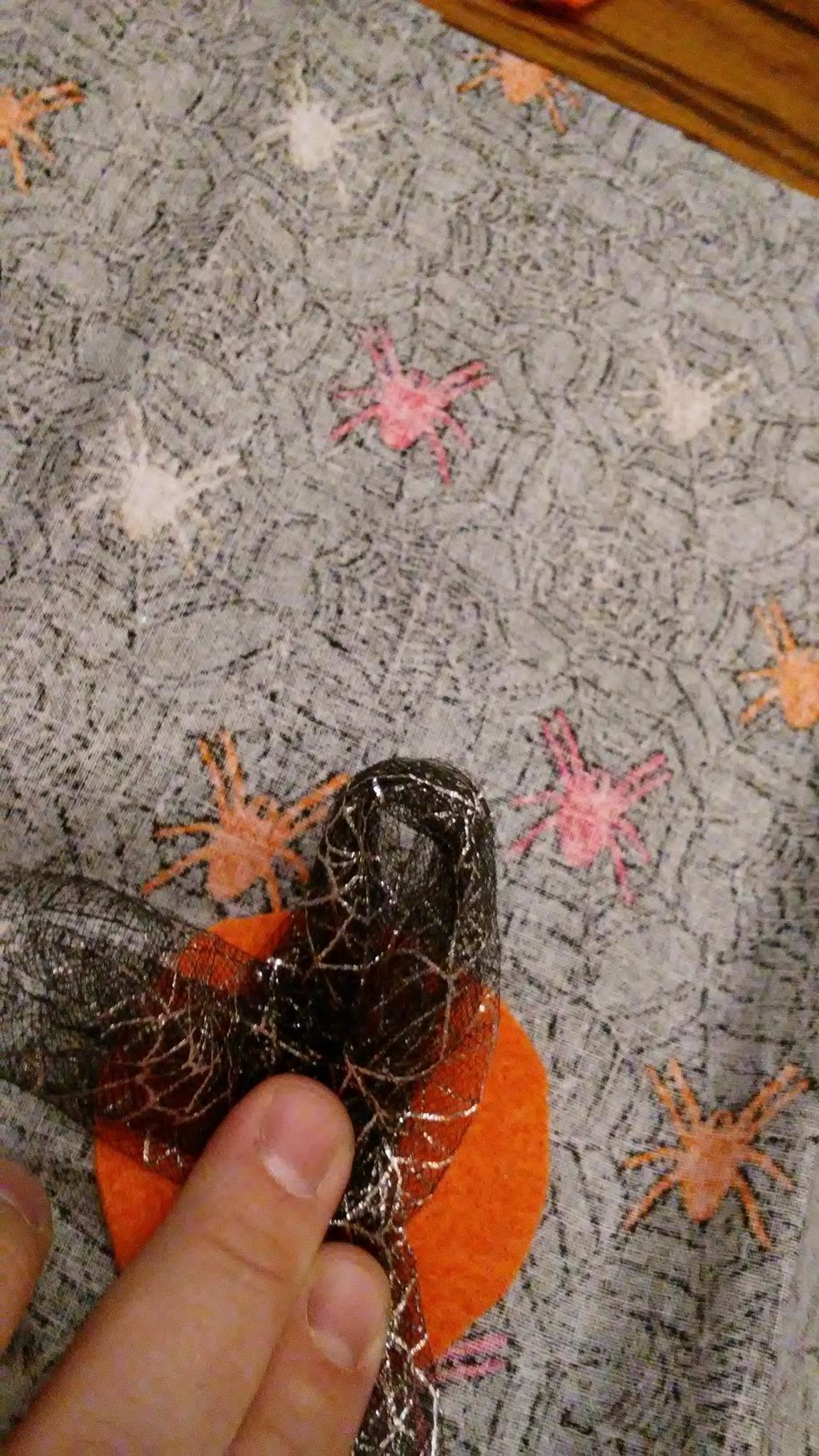 I added tulle to the headband with hot glue. Cut a piece of felt and then gather  the tulle in loops as you glue. After glued cut the loops to create a full look.