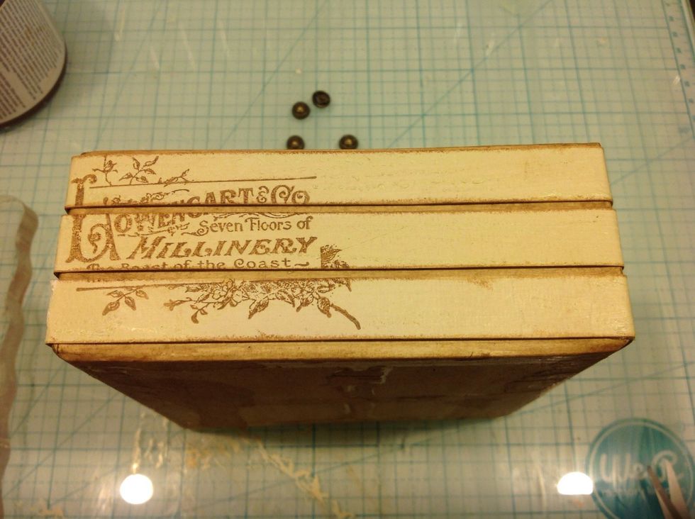 I adhered my strips around box. After I inked the edges .  Then I used some various G45 stamps . I loved this effect.
