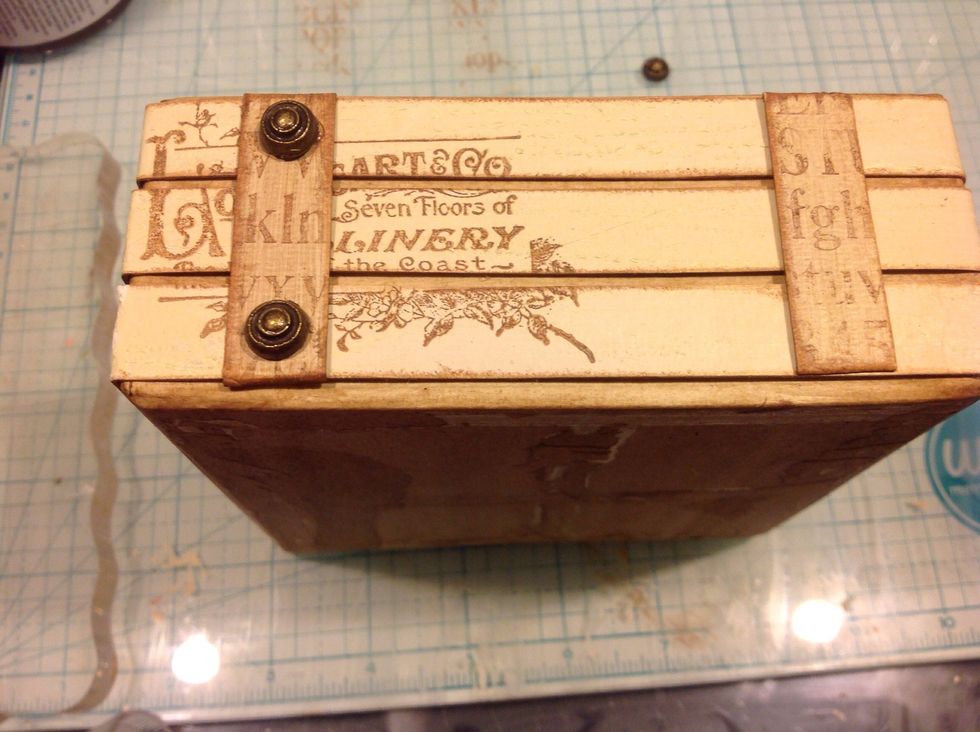 I adhered them with some Graphic 45 antique metal brads.