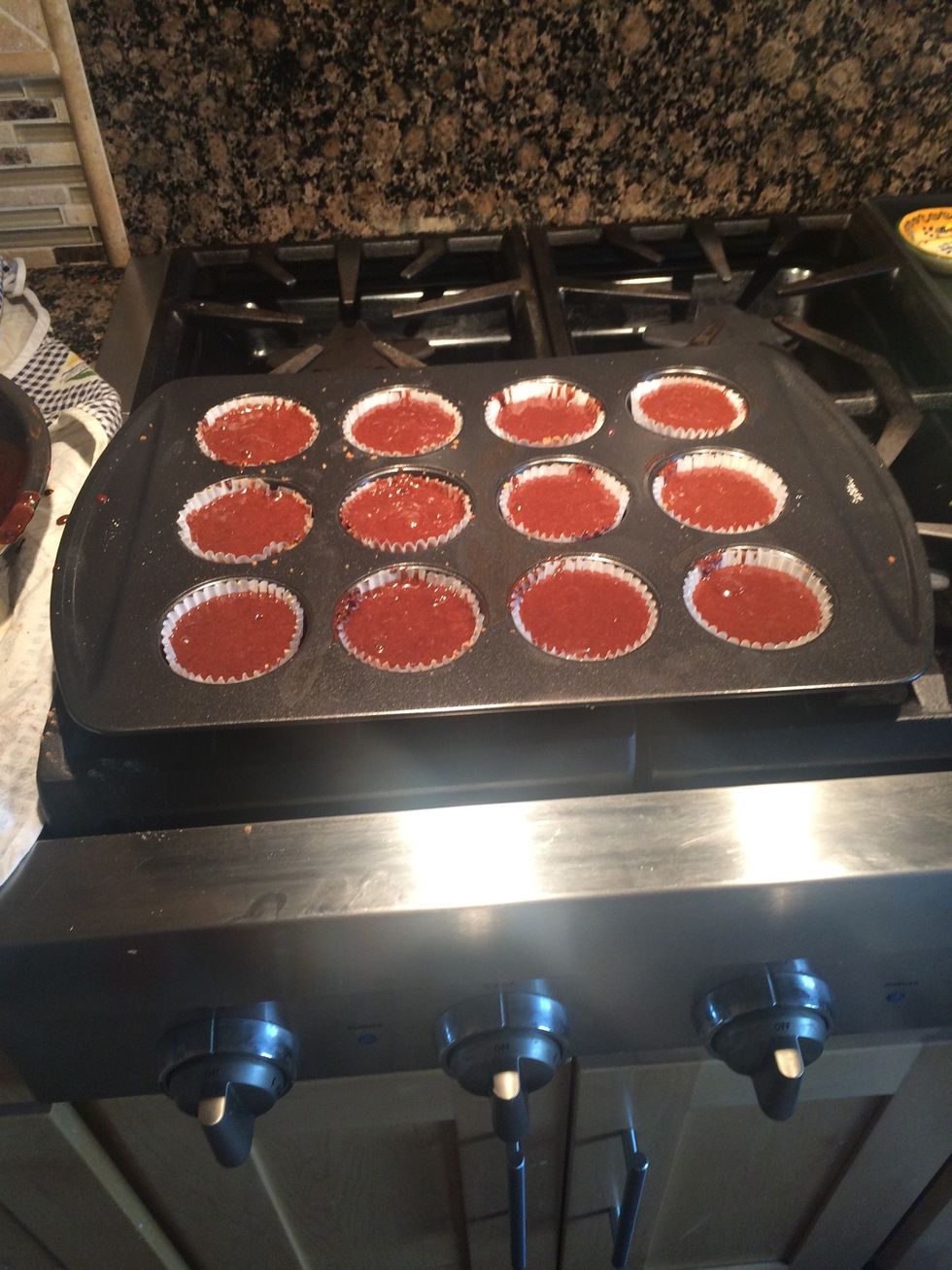 I advise you not to eat raw cupcake batter. No pour your cupcakes in the liners but make sure there's a little room on the top so when the cupcakes rise the batter won't spill out. Hopefully yours is-