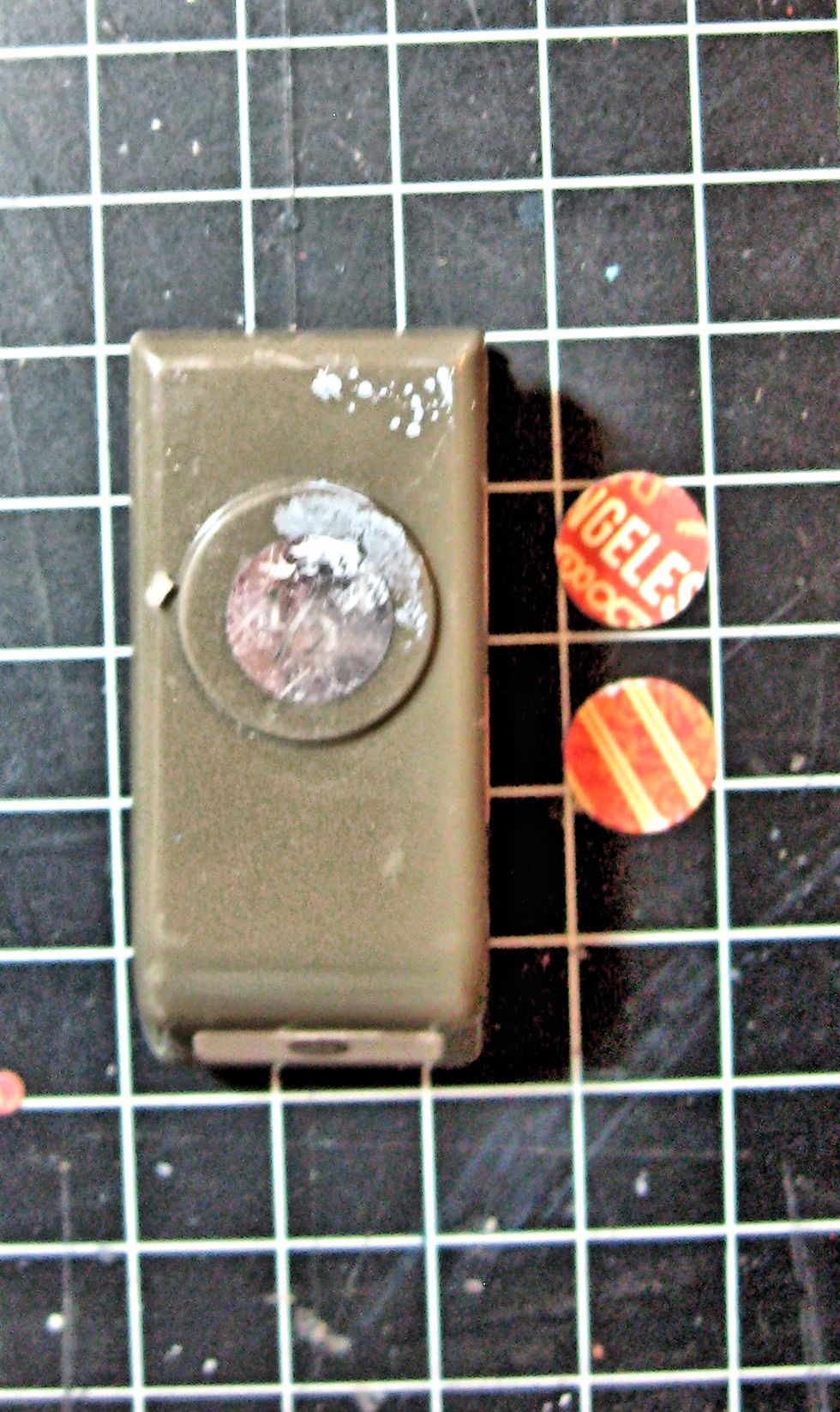 I also add a paper layer between the magnets. Use a 1/2" circle punch for these. Just glue them over the mini magnets and wait for the glue to dry! Meanwhile, we will create a hidden message spot.