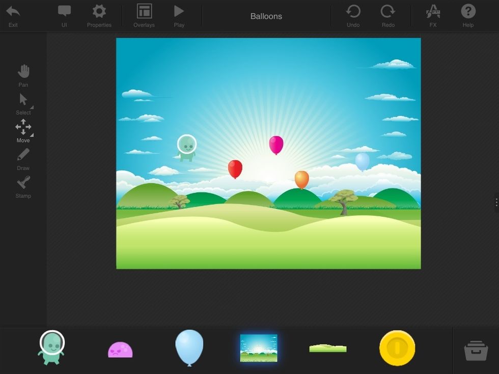 I also added a BACKGROUND. Tap the PLAY BUTTON at the top of the screen to see how your game will look.