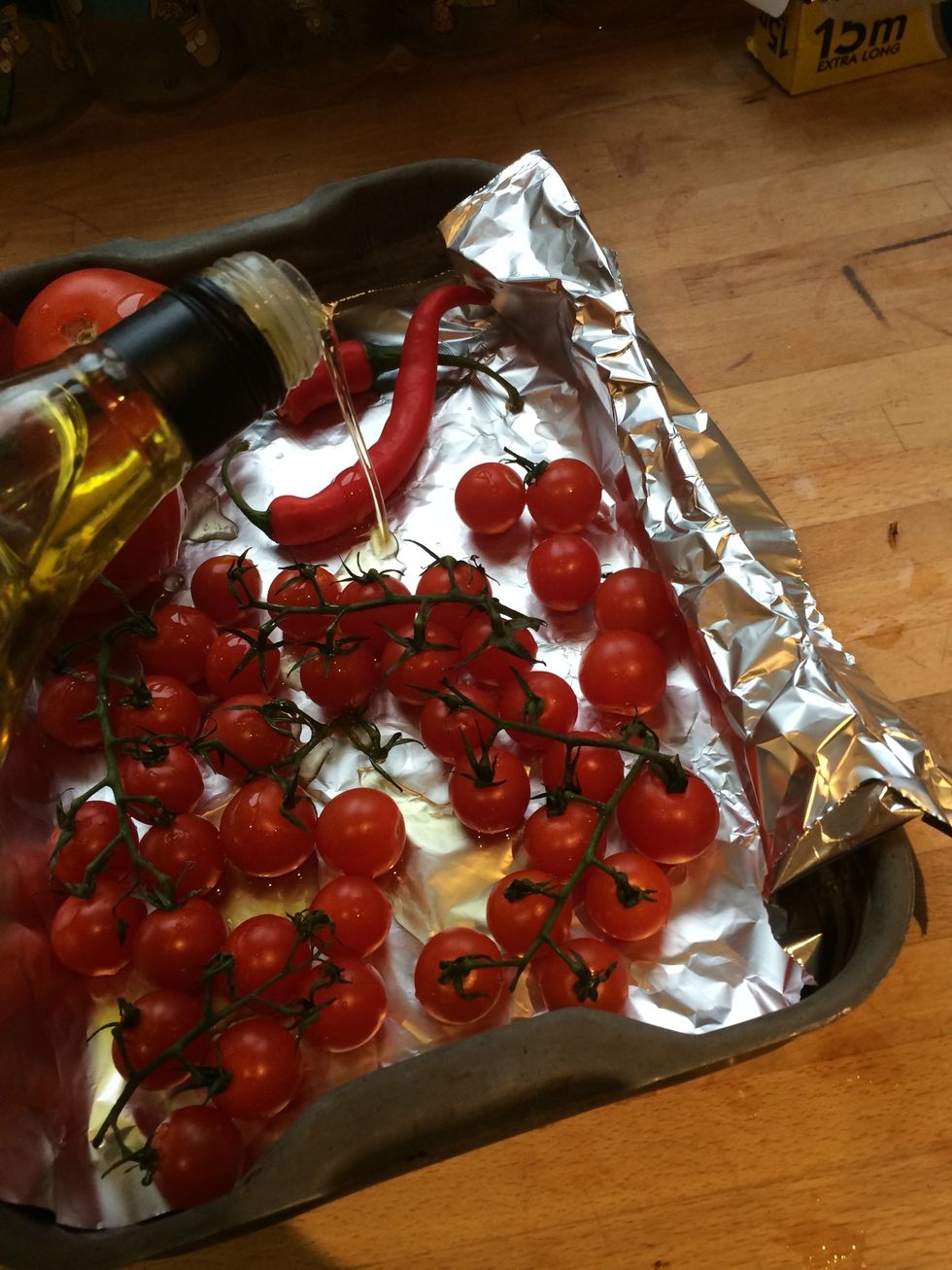 I also added a chilli to spice up the sauce, but an optional ingredient. Add any ingredients like veg/ onion to roast if you want in the sauce. Cover all in oil and salt, then rub all over.