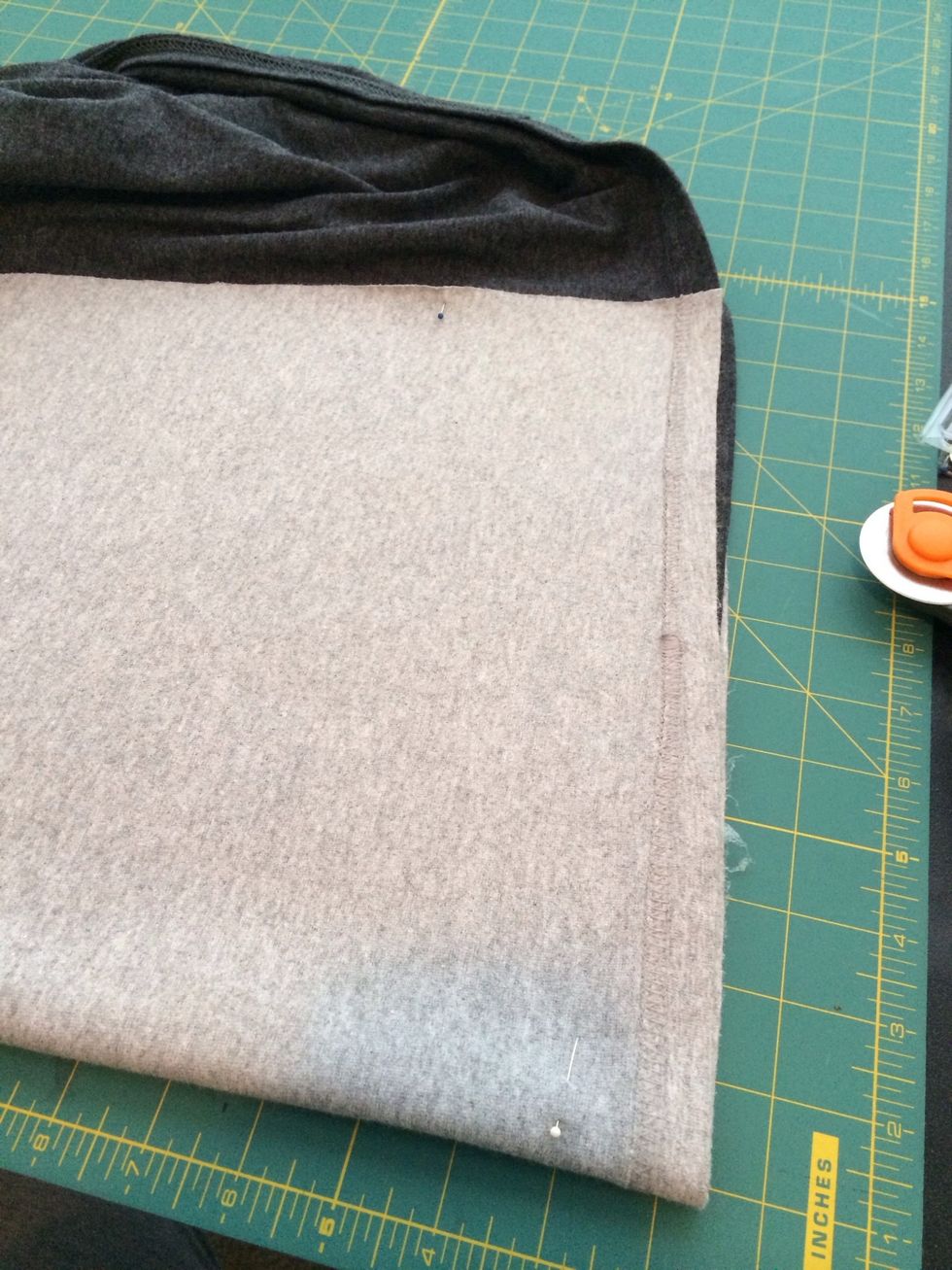 I also decided to cut the end off / it was way too long. I cut the bottom in a curved baseball style. I folded the front in half and cut it separately from the back of the shirt.