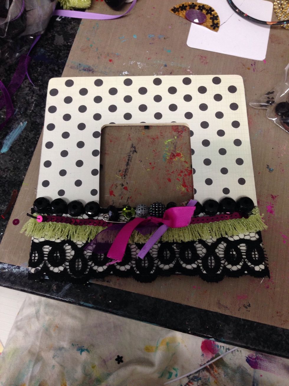 I also hot glued some beads and made a centerpiece from a large pin, some beads, and ribbon scraps. I then hot glued that to the center