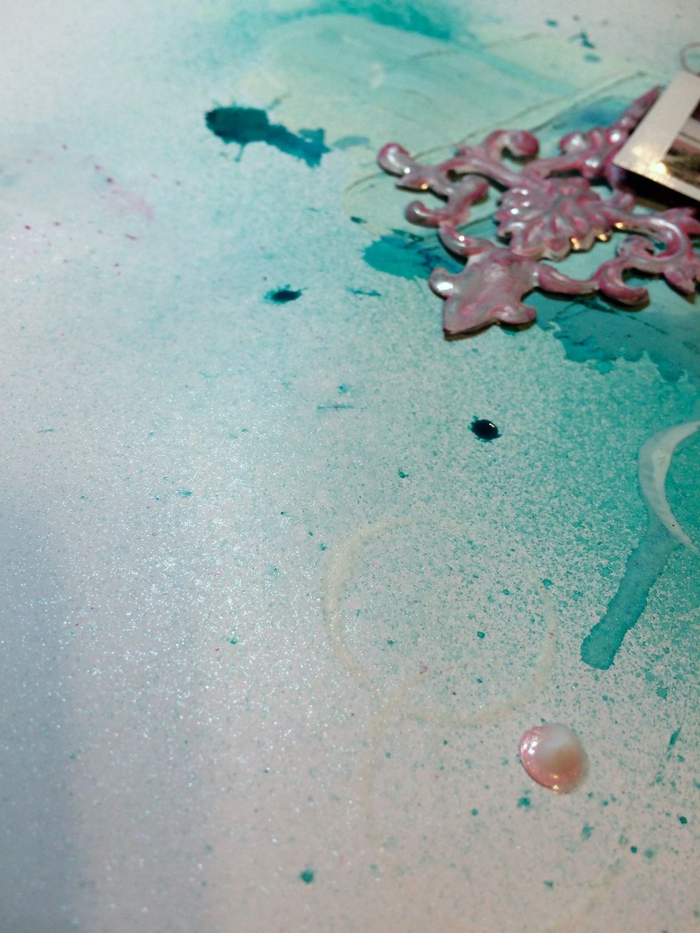 I, also, need a bit more shimmer to the layout, so I spray the Ice Fairy Dust Spray randomly onto the page.