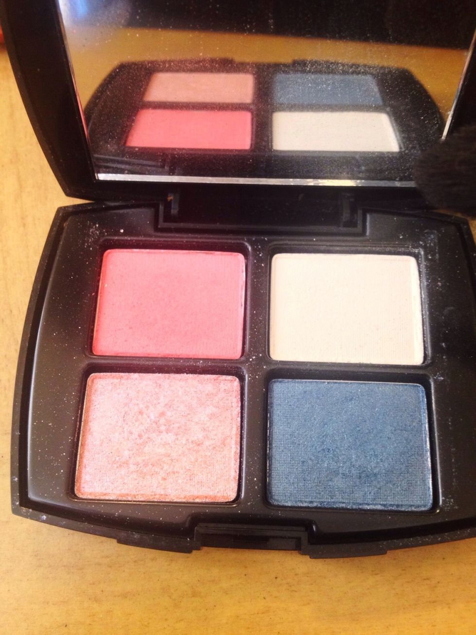 I also picked up the matte pink and blended it in the crease with a large blender brush then taking the dark navy color I went over the crease and outer v darkening it