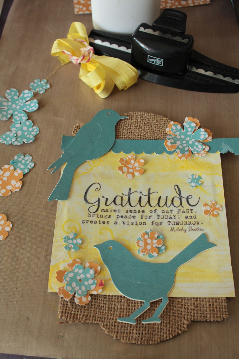 I also used a border punch to punch out a decorative strip. Play around with where you wish to place your die cuts to decorate your panel.