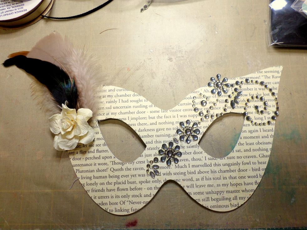 I also used the Tombow Mono Mulit Adhesive for the feathers and flower. When you are done embellishing the front, curl the mask a little so it fits on your face.