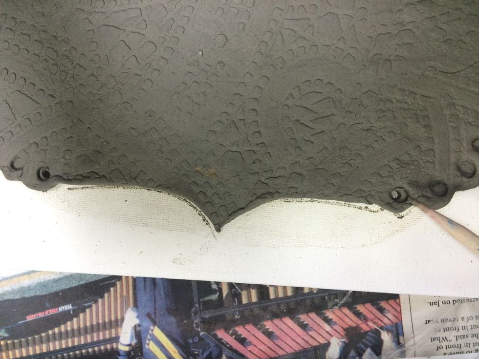 I am carving holes out at the top so that I can hang the loom for display.