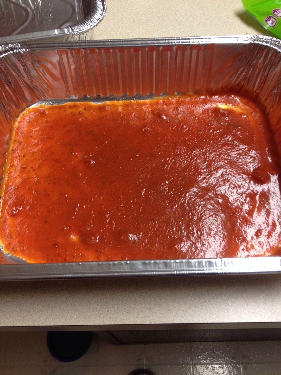 I am making a spinach lasagna here, add just enough sauce to cover the bottom of your pan