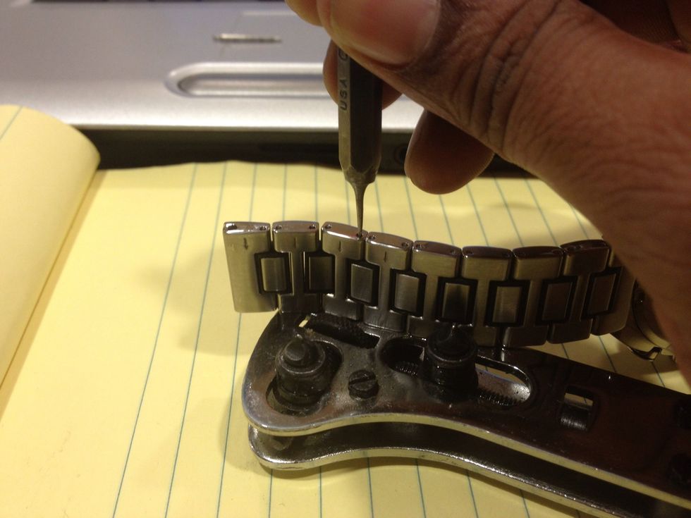 I am using a center punch I ground down on my bench grinder, to push the pins out. You may need to use a small hammer and light force to get the cotter pins out