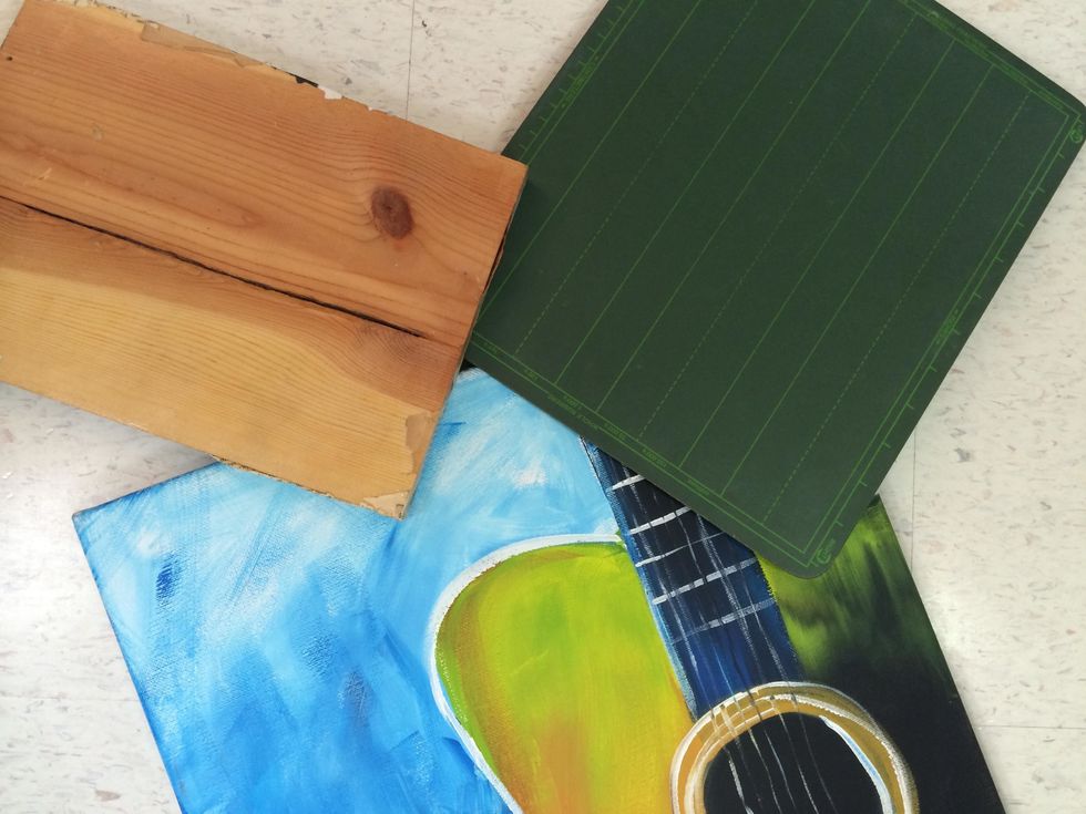 I am working on cardboard for this project but you can work on wood, a painting, or other hard surfaces such as this chalk board.