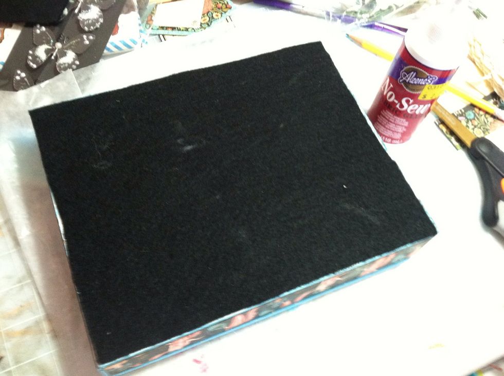 I applied black felt to the bottom using Aleen's No-Sew fabric glue.